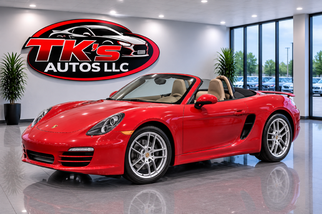 Red Porsche Boxster convertible on the lot
